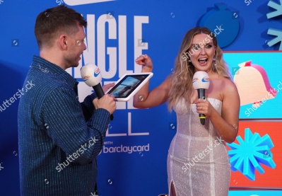 https___www_shutterstock_com_editorial_image-editorial_M0T2UbxaM7j4I430Njg1NjU3D_perrie-talks-alex-oxlaide-chamberlain-on-tablet-backstage-1500w-14977322dx.jpg