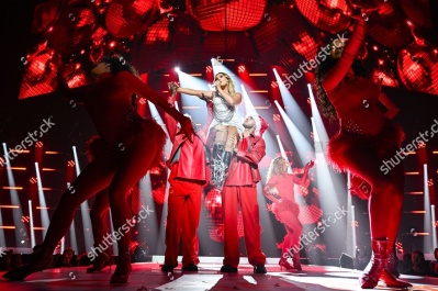 https___www_shutterstock_com_editorial_image-editorial_M0T9U5x8M4jfI139OTMwMTA3D_perrie-performing-on-stage-capital_s-jingle-bell-1500w-14977341jq.jpg