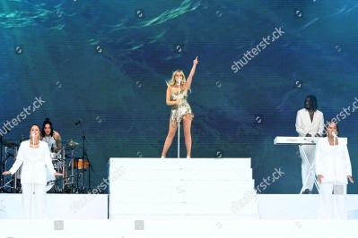 https___www_shutterstock_com_editorial_image-editorial_M1T2Qd20N2z1gd3fNDQ2Mzc3D_perrie-performing-on-stage-capital_s-summertime-ball-1500w-14539553zc.jpg