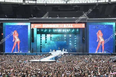 https___www_shutterstock_com_editorial_image-editorial_M3TcQ520N3zbg539Mjc5NTU3D_perrie-performing-on-stage-capital_s-summertime-ball-1500w-14539554jy.jpg