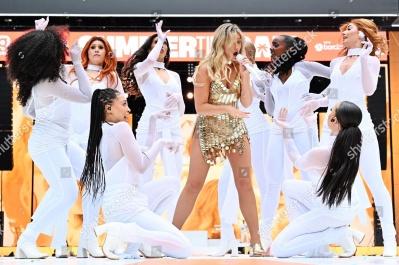 https___www_shutterstock_com_editorial_image-editorial_M4TdQe2cN2zdg73aNDQ4Mzg3D_perrie-performing-on-stage-capital_s-summertime-ball-1500w-14539553zo.jpg