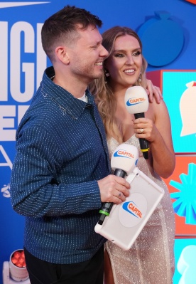 https___www_shutterstock_com_editorial_image-editorial_M4TfU9xcMbj1I634Njg1NTg3D_perrie-talks-alex-oxlaide-chamberlain-on-tablet-backstage-1500w-14977322dv.jpg