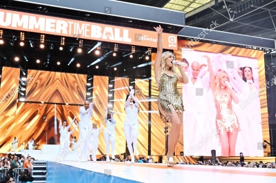 https___www_shutterstock_com_editorial_image-editorial_M5TfQ422N9z5gc33NDQ3NDE3D_perrie-performing-on-stage-capital_s-summertime-ball-1500w-14539553zl.jpg