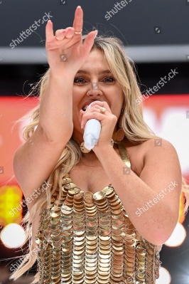 https___www_shutterstock_com_editorial_image-editorial_M7TdQ125Nbz2g13fMTU0OTY3D_perrie-performing-on-stage-capital_s-summertime-ball-1500w-14539542ll.jpg