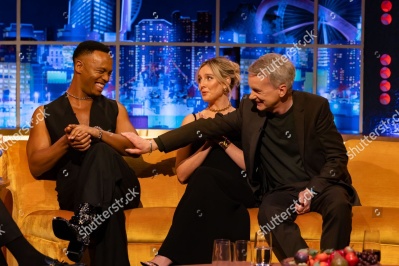 https___www_shutterstock_com_editorial_image-editorial_MbT5Q11eN2j9c6y1MjE1NDc3D_johannes-radebe-perrie-edwards-frank-skinner-1500w-14430234aq.jpg