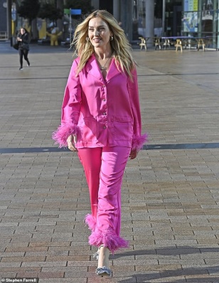 90562831-13933931-Perrie_Edwards_turned_heads_in_a_pink_satin_outfit_after_showing-m-93_1728326904667.jpg