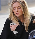 90560551-13933931-She_carried_her_phone_close_to_her_chest_as_she_walked_around_th-a-6_1728324310663.jpg